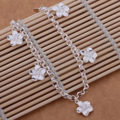Silver Charm Bracelets, a Symbol of Luck: Trendy and High-Quality Jewellery Adorned with Five Flowers, Perfect for Women with a Fashionable Taste